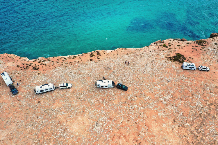 drone picture over caravans at a cliff edge