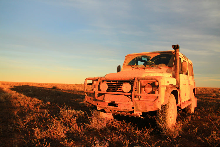 muddy 4wd in outback paddock