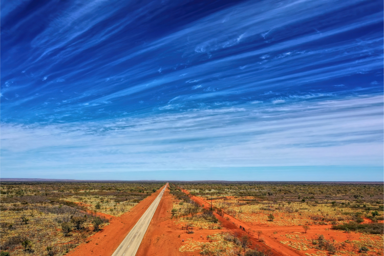 outback open road red dirt blue sky